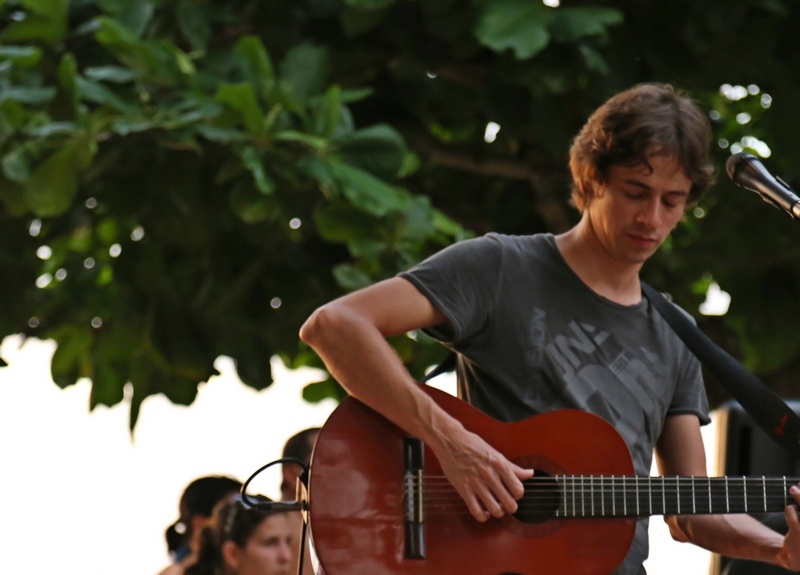 Guy playing a guitar in Playa Hermosa Costa Rica